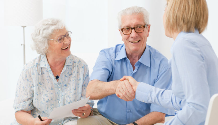 accountant-shaking-hands-with-retired-couple