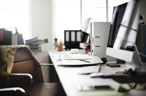 Computer-chair-and-desk-full-of-files