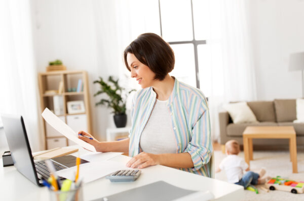 Individual reviewing personal tax documents at home with professional support